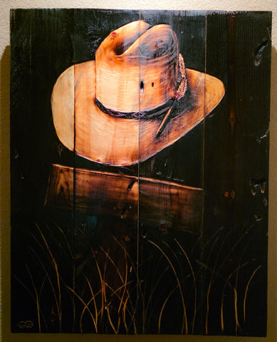Cowboy hat on cross